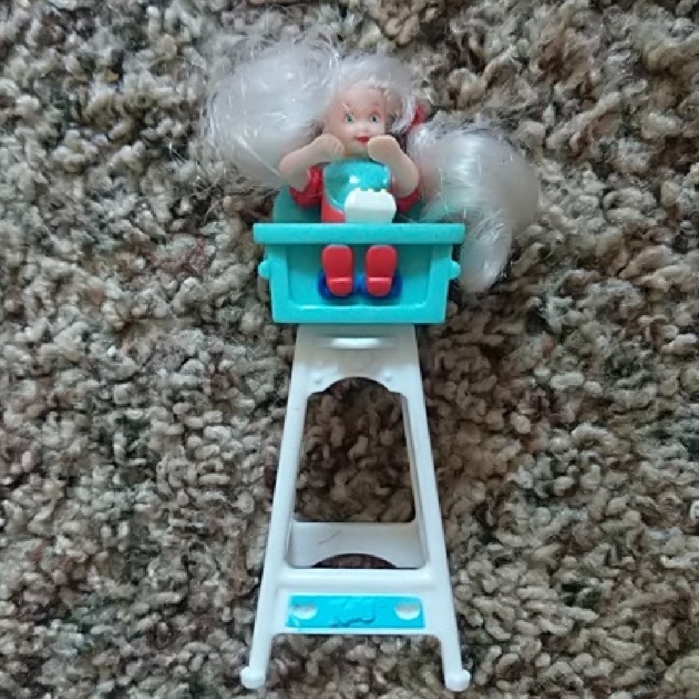 Mattel Doll in Turquoise High Chair with White Hair and Red Outfit
